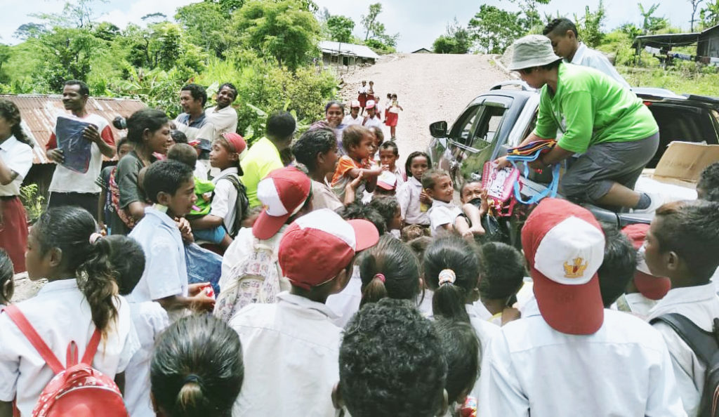 Esther unloading goods from the truck